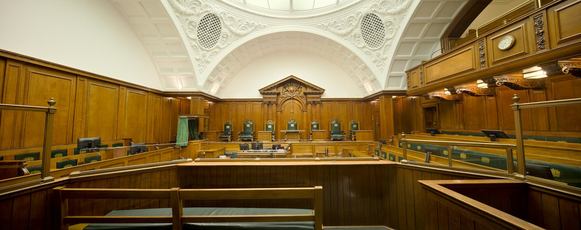 An empty wood-panelled courtroom