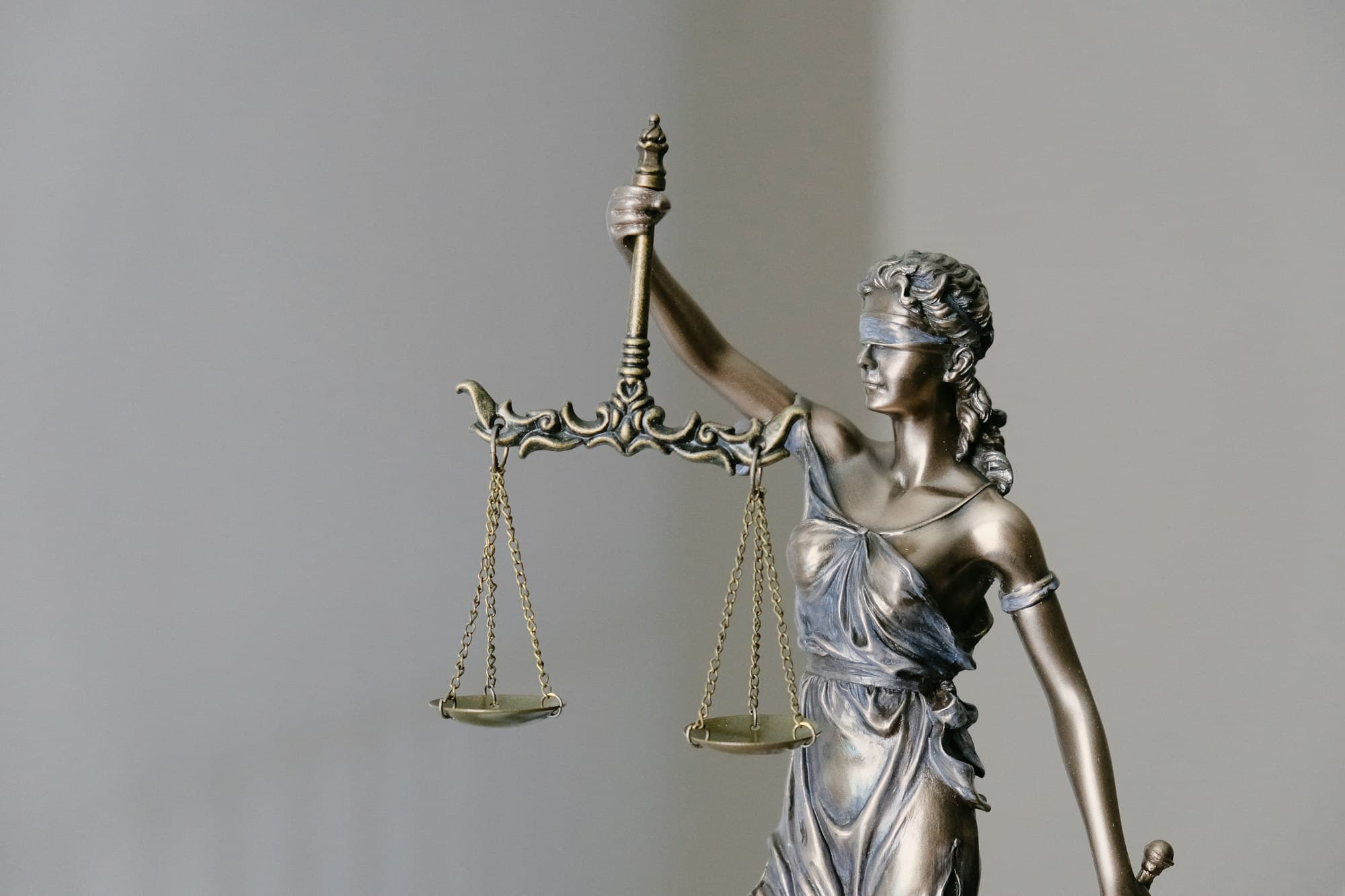 A statue of Lady Justice holding scales and a sword